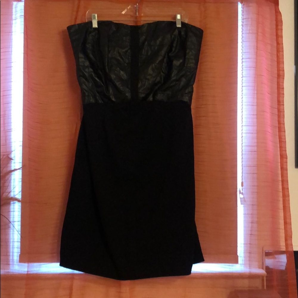 Strapless dress with faux leather trim.